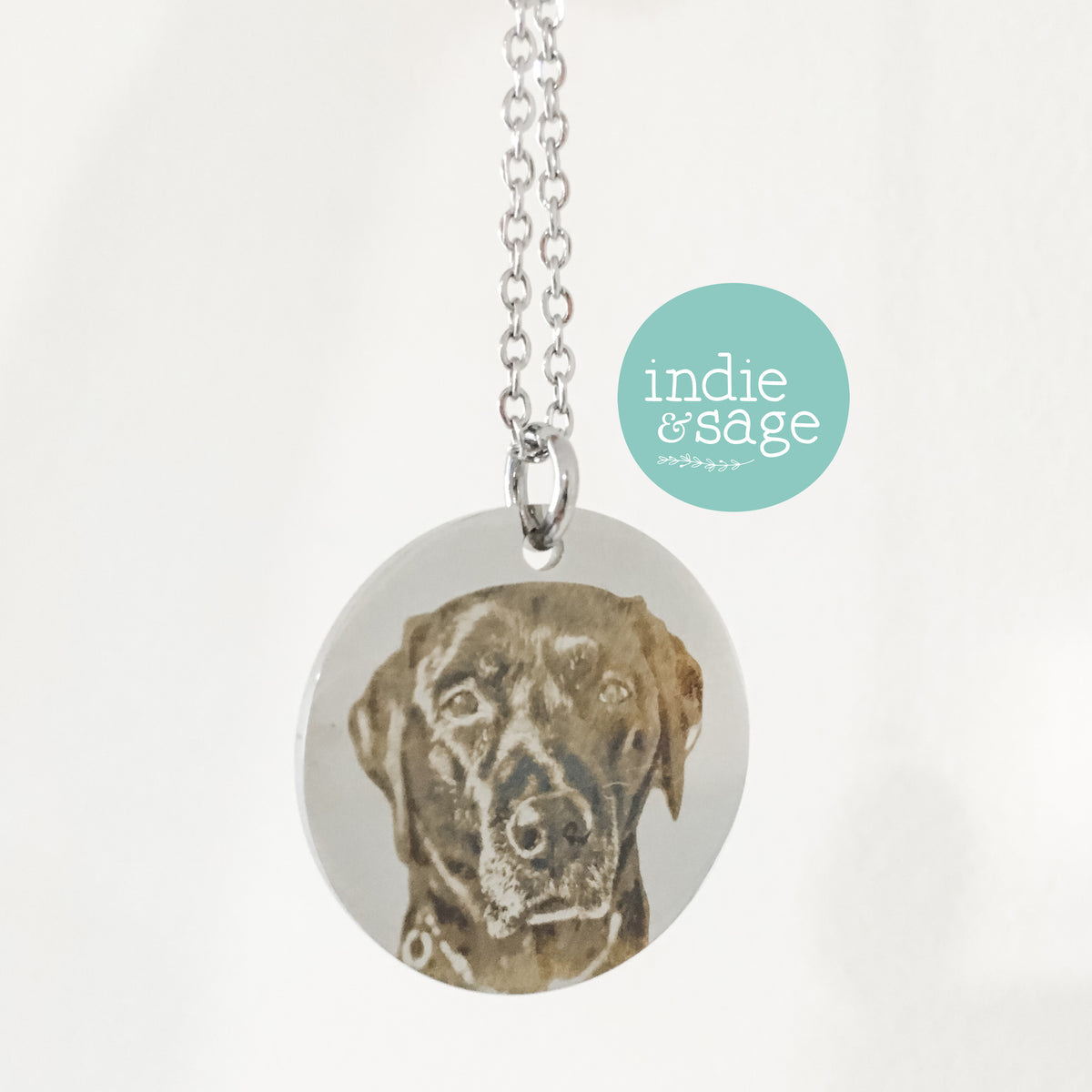 Engraved dog portrait necklace featuring a your dogs photograph making it a beautiful memorial keepsake. The back Labrador pictured is my beautiful girl Kira who passed away on the 12th February 2026 at 15 years old. I'm heartbroken without her but so happy I have this piece to keep her close.