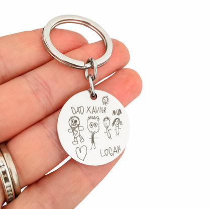Childs drawing engraved onto a stainless steel pendant creating a beautiful personalised keepsake keyring.