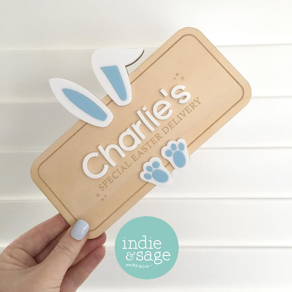 Personalised Easter crate sign made from plywood and acrylic, featuring bunny ears and a custom child’s name. Handmade in Adelaide Hills, this Easter box plaque reads “Special Easter Delivery” and is designed to attach to a wooden crate for Easter morning surprises.

#FirstEaster
#BabyFirstEaster
#PersonalisedEasterGift
#CustomEasterSign
#EasterGiftForKids
#EasterKeepsake
#EasterCrateSign
#EasterBasketIdeas
#HandmadeEasterGift
#UniqueEasterGift
#EasterGiftAustralia
#Easter2026