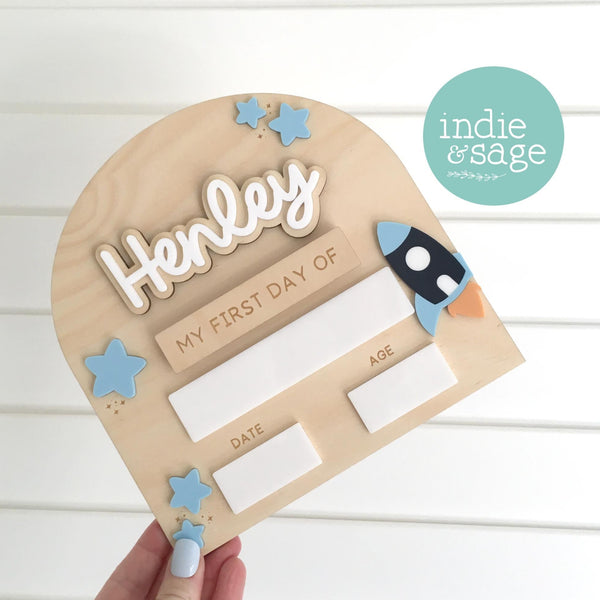 Wooden first day of School board with interchanagable name plates for first and last day of school.

This piece will be carefully engraved and cut and features beautiful blue acrylic stars and a rocket, perfect for any little one obsessed with space!

#firstday #firstdayofschool #backtoschool #firstdaygifts #backtoschoolboard #backtoschoolsign #firstdayofkindergarten #school #kindy #daycaregifts #firstdayofsign #firstdayofprint