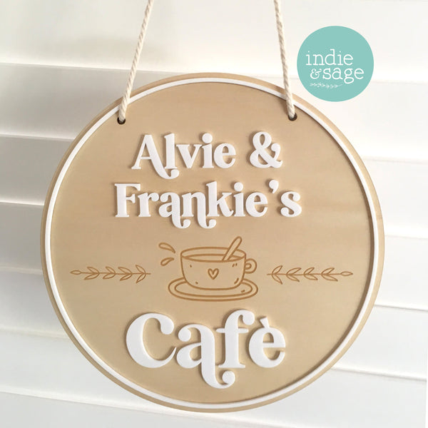 Kids Play cafe Sign made from Plywood and Acrylic, your childrens names will appear in raised white acrylic

#playcafe #playkitchen #playroom #playroomdecor #Kidsplayroom #kidsnamesign #personalisedchristmasgifts #giftsforkids #uniquepersonalisedgifts #kidscafesign #kidscafestand #Playcafe #woodenplaykitchen #woodenplay #woodentoys #montessori #montessorigifts #firstbirthdaygiftidea @personalisedgiftideasforkids