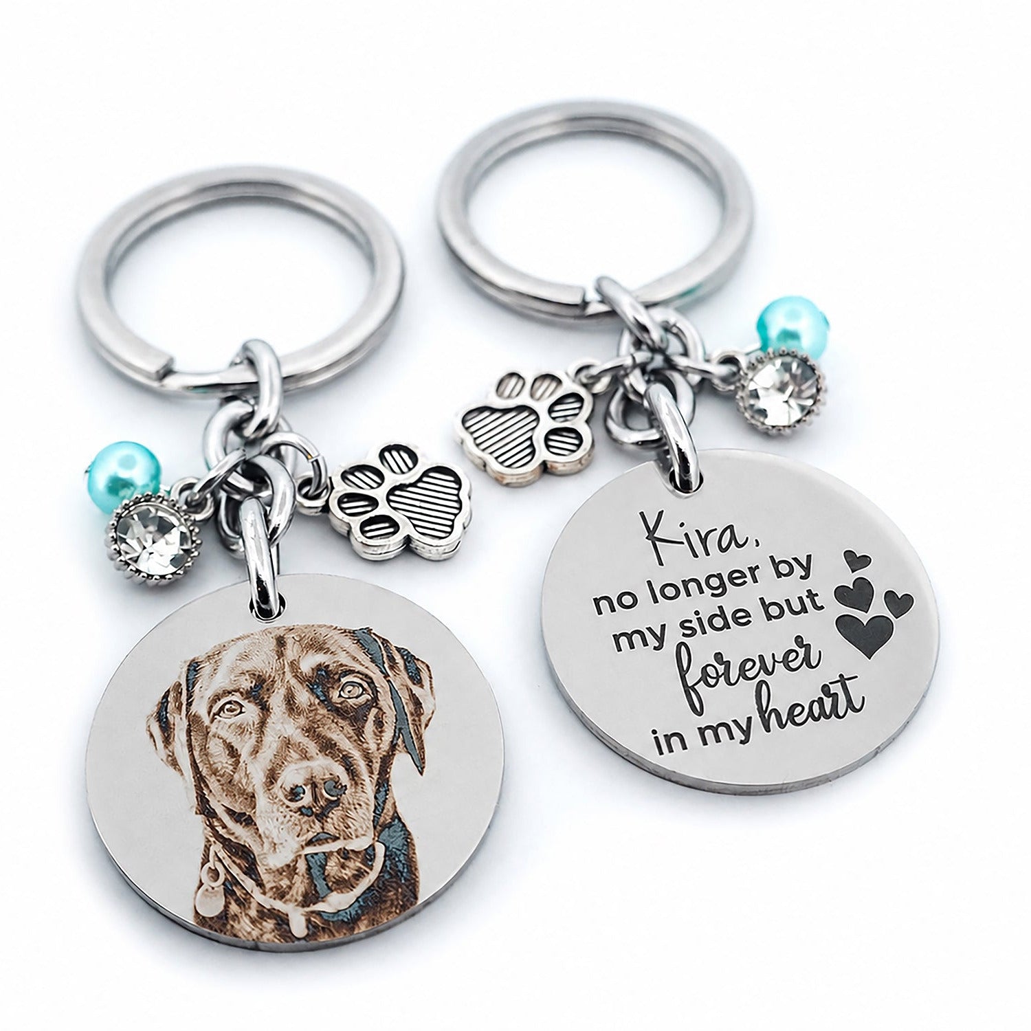 Angled view of a personalised dog memorial keychain with a custom engraved pet portrait and engraved remembrance message, designed as a thoughtful pet loss keepsake gift.