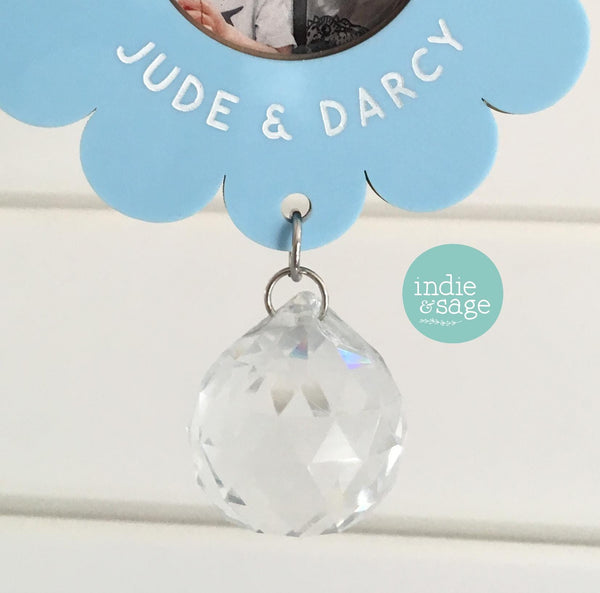 Custom Grandma favourite blooms wall hanging with photo flowers and crystal suncatcher reflecting rainbow light on white background