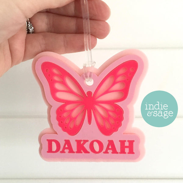 Butterfly Bag Tag - Layered with three shades of pink and personalised with your childs name. Designed with little people in mind, large size and layered for strength so they can withstand whatever your little people throw their way.