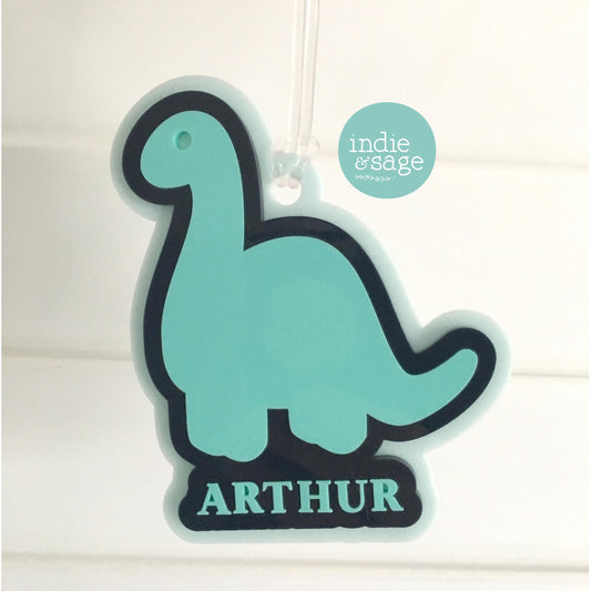 Dinosaur Bag Tag - Layered with a mix of cool pint, dark blue and spearmint and personalised with your childs name. Designed with little people in mind, large size and layered for strength so they can withstand whatever your little people throw their way.