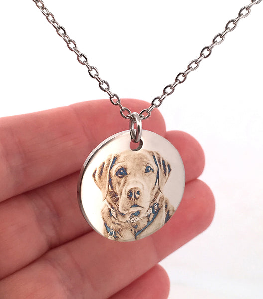Close-up of a personalised dog memorial necklace featuring a custom laser engraved pet portrait on a polished stainless steel pendant. A meaningful keepsake to honour the memory of a beloved dog.