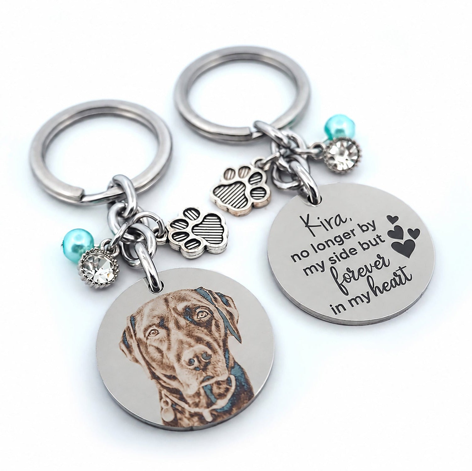 Front and back view of a personalised pet memorial keychain showing a custom engraved dog portrait on one side and a meaningful memorial quote on the reverse.