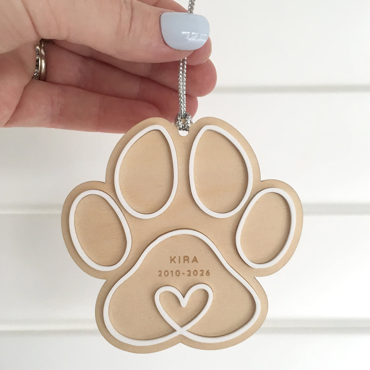 paw print shaped personalised christmas tree decoration