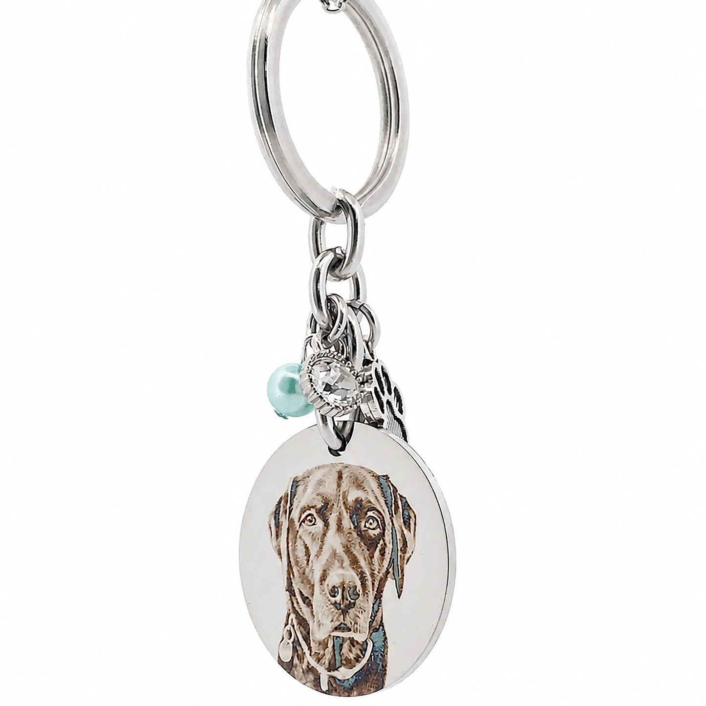 Side profile of a stainless steel personalised pet memorial keychain highlighting the engraved pendant, paw charm, birthstone bead and premium craftsmanship.